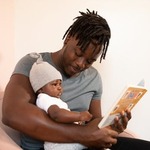 Montessori father reading to his child