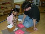 Montessori teacher working with a student