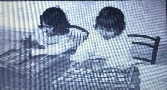 children working with the Montessori dressing frames, 1912