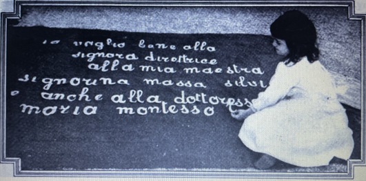 Child working with the Montessori Movable Alphabet, 1912