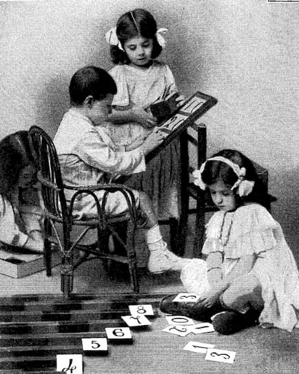 Year 1911 Montessori children working with math materials
