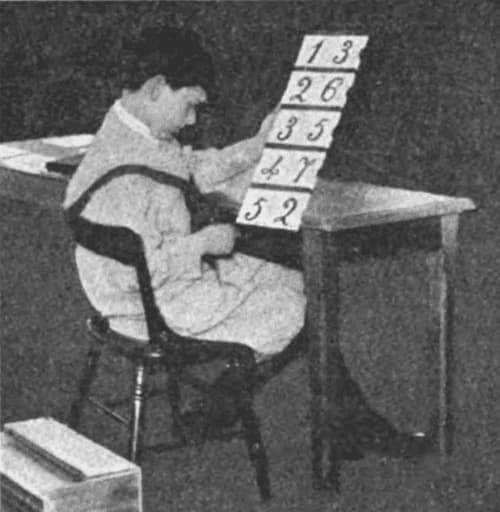 Child working with a Montessori Math material