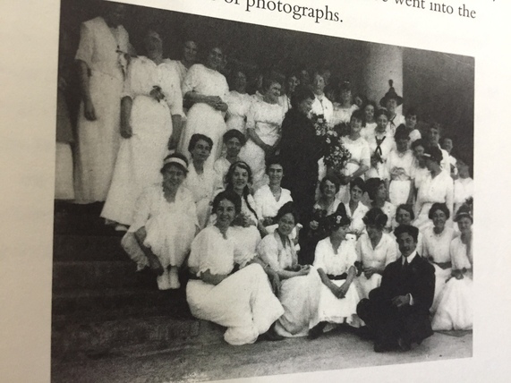 Mario Montessori sitting with Maria's students during his visit to America. 1915