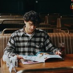 Man Reading a Magazine